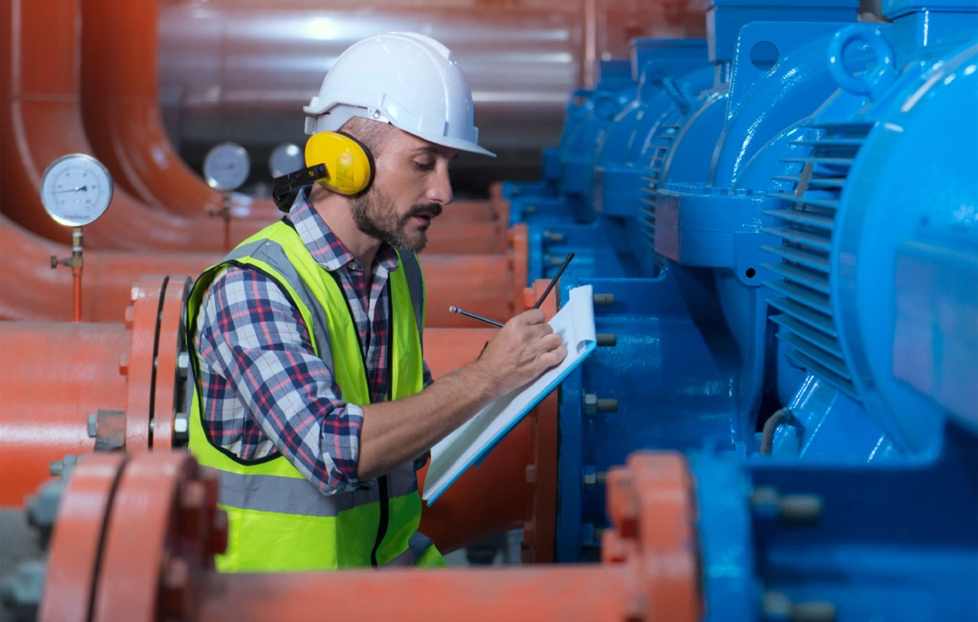 engineer inspecting industrial equipment”